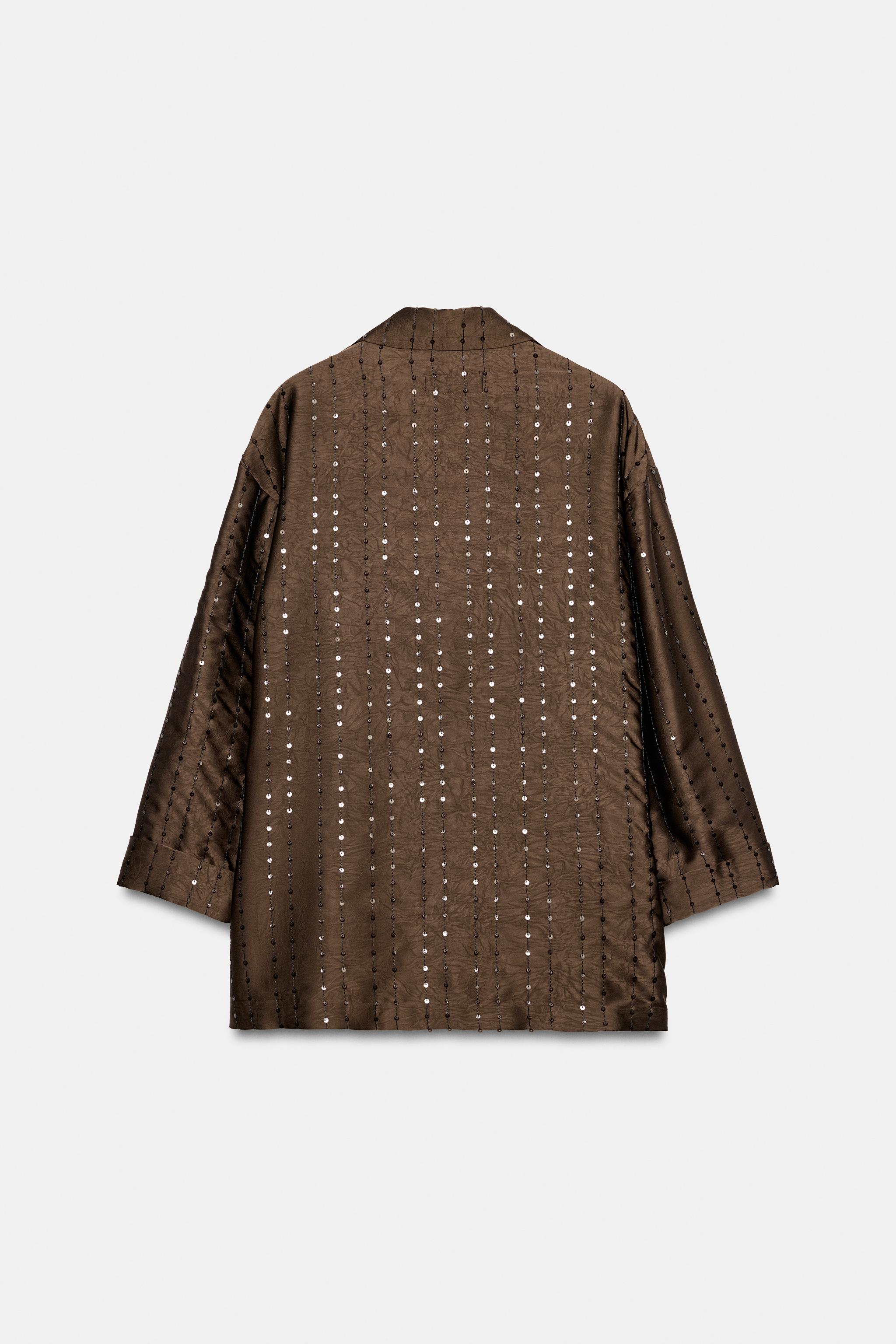VESTE À PAILLETTES ET BOUTONNAGE CROISÉ